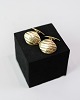Cufflinks in 14 
kt. gold, 
stamped 585. 
Grooved design. 
L: 2 cm, Dia: 
1.5 cm. Weight: 
6.7 g. ...
