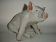 Royal Copenhagen Figurine, Sitting Pig.Decoration number 414.2nd grade.Height 16 cm. ...