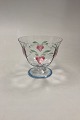Orrefors Maja 
Glass bowl with 
red flowers and 
blue striped 
rim on foot. 
Designed by Eva 
Englund. ...