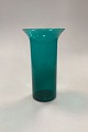 Green 
cylindrical 
Glass Vase, 
large. 
Presumably of 
foreign origin. 

Measures 21 cm 
/ 8.26 in.