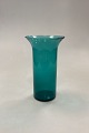 Green 
cylindrical 
Glass Vase, 
medium. 
Presumably of 
foreign origin. 
Light traces of 
use, see ...