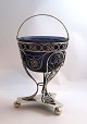 Frederik Mortz 
Klose, 
Copenhagen. 
Silver candy 
bowl in 
filigree with 
blue glass 
insert. Height 
...