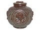 Royal 
Copenhagen art 
pottery, lidded 
bowl decorated 
with faces and 
a cat on the 
lid.
Designed ...