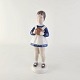 Figur i hvidt 
porcelæn med 
malede detaljer 
i brune, blå og 
røde nuancer
Nr 2391
Producent ...