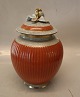 212-2781 RC 
Grey lidded 
vase with 
orange and gold 
25 cm 
In mint and 
nice condition 
Craquelé, ...
