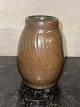 Ceramic vase 
from Lauritz 
Hjorth on 
Bornholm. 
Decorated with 
vertical 
(turning) 
grooves. 
Covered ...
