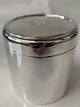 English silver tea can with monogram on the lid.