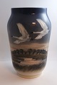 Royal Copenhagen. Porcelain vase with swans. Model 1955/1217. Height 25 cm. (2 
quality)