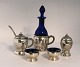 Danish work. Silver (830). 2 salt jars with spoons, pepper shaker, mustard jar 
and vinegar bottle. 7 parts. Produced 1918.