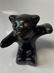 Bornholm 
pottery, Deer, 
Small brown 
bear sitting on 
the butt.
Height 5 cm.
Stamp: L. ...