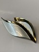 Beautiful 
brooch shaped 
like two 
leaves, coated 
with white 
enamel. The 
soft lines give 
the ...