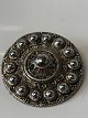 This silver 
brooch is made 
with many 
beautiful 
details, and 
has a very 
dynamic and 
lively shape. 
...