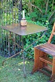 Old French café 
table in 
polished metal 
and wrought 
iron ...