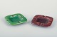 Two ashtrays, 
Aluminia.
Two square 
ceramic 
ashtrays with 
central recess 
and four 
cigarette ...