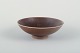 Aluminia bowl 
with fish 
motif.
Aluminia 
faience bowl on 
foot ring, 
brown glaze 
with impressed 
...