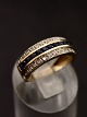 9 carat gold 
ring size 55 
with several 
small sapphires 
and diamonds 
item no. 617642