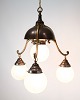 3-armed Art 
Nouveau 
chandelier from 
the 1930s in 
burnished brass 
with opal glass 
balls. Classic 
...
