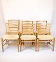 Set of six 
church chairs, 
designed by 
Kaare Klint and 
made of solid 
oak with wicker 
seats. The ...