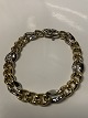 Two-tone 
bracelet in 14 
Karat gold.
Stamp: BEE 
585.
Length 18,5 
cm.
Width 8.34 mm.
The ...