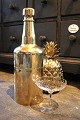 Old champagne 
cooler in the 
shape of a 
large bottle in 
brass that can 
be opened and 
filled with ...