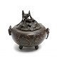 Japanese 
incense burner 
of patinated 
bronze, 
partially 
pierced lid 
with a 
grasshopper, 
sides ...