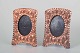 Two decorative 
picture frames 
in embossed 
copper with 
floral motifs 
and oval 
openings. 
Reverse ...