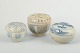 Three Small 
Lidded Jars, 
Korea.
A set of three 
small lidded 
jars in glazed 
tones, crafted 
in ...