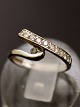 14 carat white 
gold ring size 
48 with several 
diamonds 
stamped 14K 
item no. 618469
