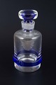 Decanter with 
stopper in 
clear and blue 
glass. Probably 
Murano, Italy, 
mid-20th ...
