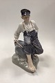 Royal 
Copenhagen 
Figurine Boy on 
Rock No. 1659