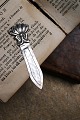 Old bookmark in 
silver 
(stamped) 
Length 7.2 cm. 
with floral 
motif.
