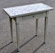 Louis XVI white 
painted tile 
table, 20th 
century. With 
tapered legs 
with flutes. 
Edge with ...