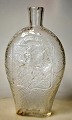 Swedish pocket 
lark in clear 
glass with 
Oscar II 
monogram and 
the Swedish 
lion, 19th 
century. ...