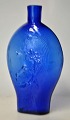 Swedish pocket 
lark in cobalt 
blue glass, 
19th century. 
Decorated on 
the side with 
hunting ...