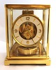 Jaeger 
LeCoultre. 
Atmos. Table 
clock in brass 
case with glass 
sides. Height 
22.3 cm