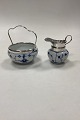 German 
blue-fluted 
Sugar and Cream 
set, with metal 
mounting, 
possibly 
nickel. 
Cream jug ...