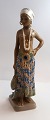 Dahl Jensen. 
Porcelain 
figurine. Girl 
from eastern 
Sierra Leone. 
Model # 1117. 
Height 25 cm. 
(1 ...
