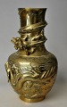 Chinese bronze 
vase, 20th 
century. 
Decorated with 
slithering 
dragons. Body 
richly 
decorated with 
...