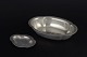 Just Andersen
Oval and round 
bowls in 
pewter, both 
with softly 
curved organic 
forms, ...