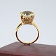 A ring in 14k 
gold set with a 
blue topaz. 
Ring size 
52-53.
Please contact 
us if ...