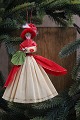 Old Christmas 
tree ornament, 
nice lady with 
sleeve and bag 
made of colored 
crepe paper. H: 
15cm.