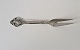 Sering fork in 
silver and 
steel decorated 
with bunch of 
grapes. 
Stamp: Cohr - 
the three ...