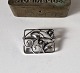 Silver brooch 
decorated with 
flowers. 
Stamp: 
Master's stamp 
- 830s - 367. 
Measurements 3 
x ...
