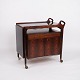 bar cabinet 
from Dyrlund, 
made of 
rosewood with 
black formica 
and handles in 
solid rosewood. 
The ...