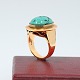 Ring of 14k gold, set with a large turquoise