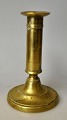 Antique Danish 
Empire brass 
candlestick, 
circa 1820. 
Round base and 
smooth stem. 
H.: 15 cm.