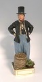 Royal 
Copenhagen. 
Overglaze 
figure Jan 
Hansen Schmidt 
Market costume, 
Amager. Model 
12103. ...