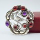 Georg Jensen 
jewellery.
Georg Jensen; 
Silver brooch 
no. 159, 
adorned with 
granates and 
...