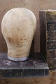 Decorative, old 
French hat head 
made of wood 
and covered 
with raw 
fabric. H: 
24.5cm.