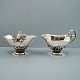 Georg Jensen silver.Georg Jensen; A sugar bowl and creamer of hammered sterling silver.Sugar ...